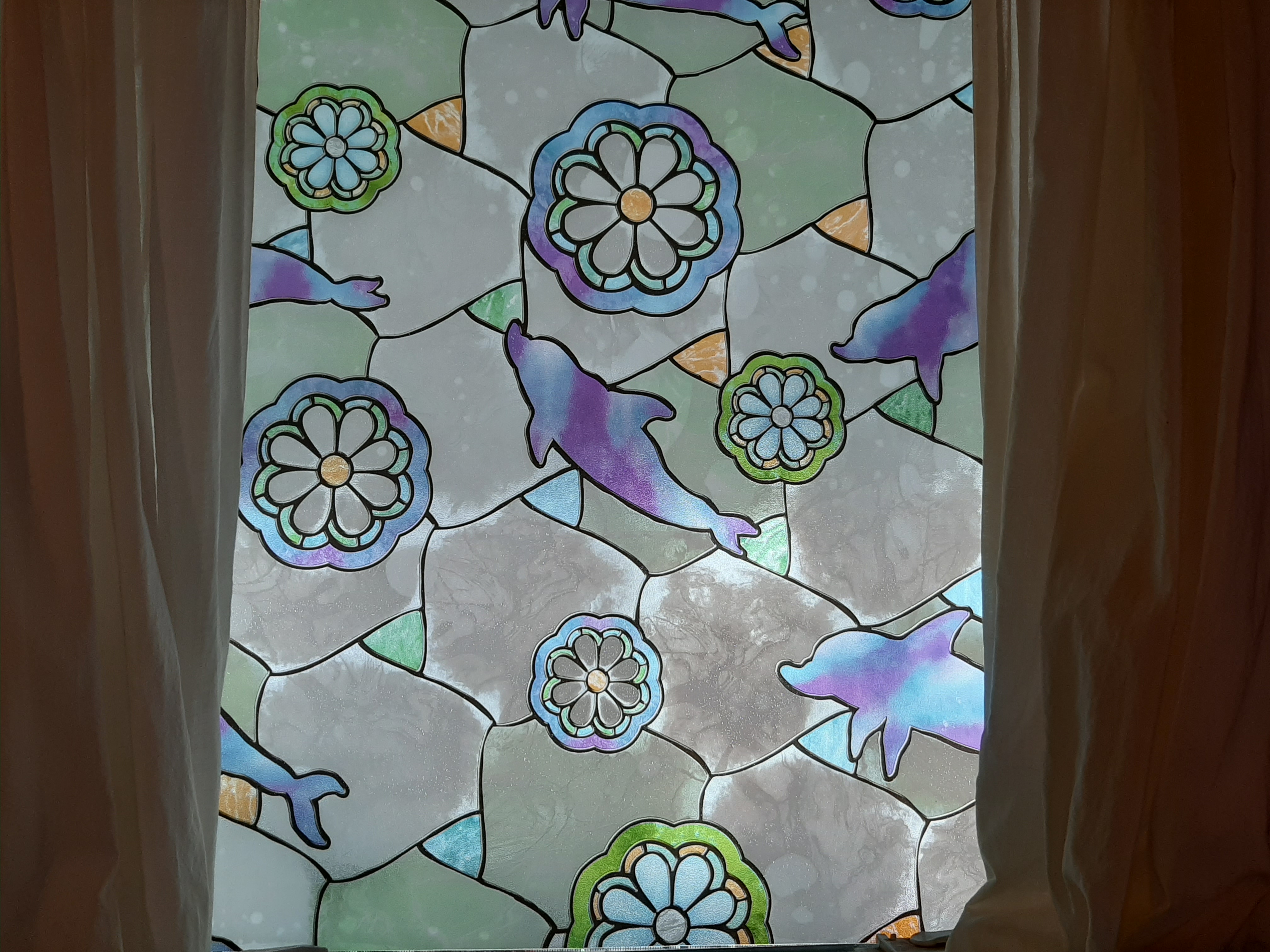 We put stained glass film on windows, eliminated curtains